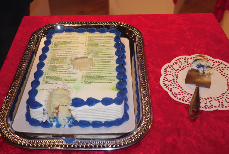 Artwork from Fabiola Valenzuela's "Cake" series, which features a U.S. Citizenship questionnaire printed on an edible cake.