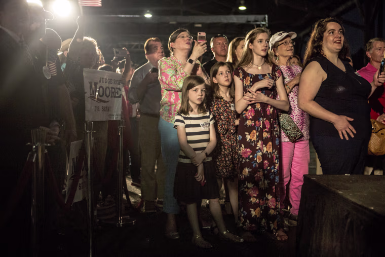 Image: Moore supporters wait for the rally to begin.
