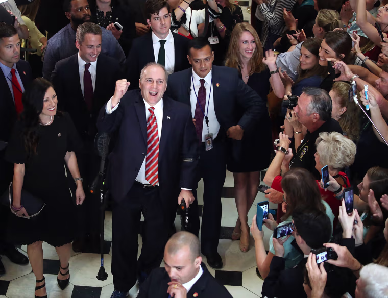 Image: House Republican Whip Steve Scalise reacts to cheers as he returned to the Capitol Hill for the first time after being shot in June