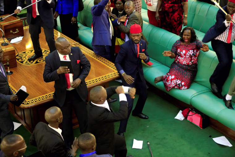 Image: Ugandan opposition lawmakers fight with plain-clothes security in parliament in Kampala