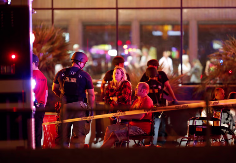 Image: People wait in a medical staging area on October 2, 2017, after a mass shooting at a music festival in Las Vegas
