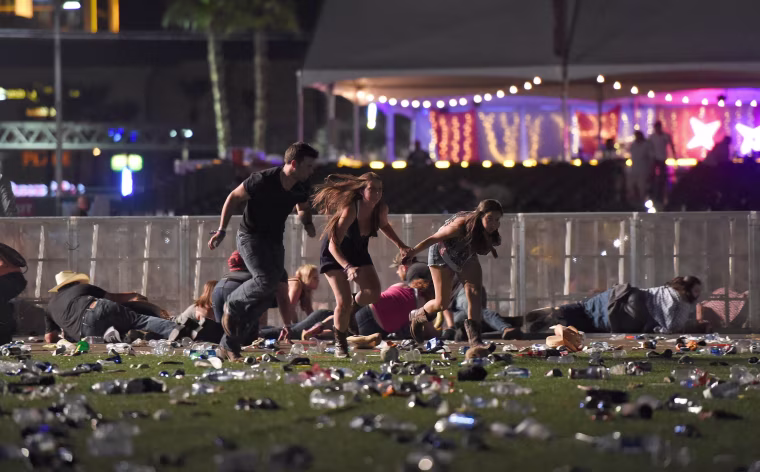 Image:  People run from the Route 91 Harvest country music festival