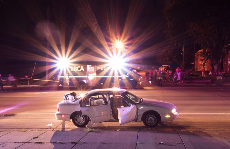 Image: The car of Philando Castile is surrounded by police vehicles