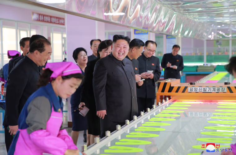 Image: Kim Jong Un visits a footwear factory