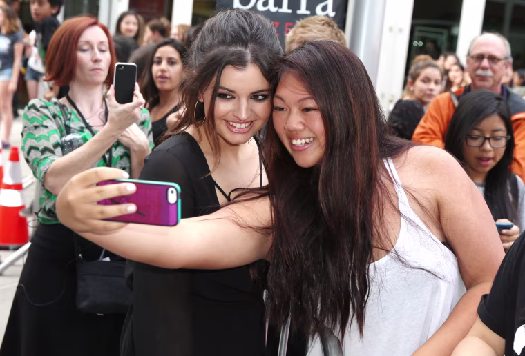 Image: Rebecca Black takes a selfie with a fan