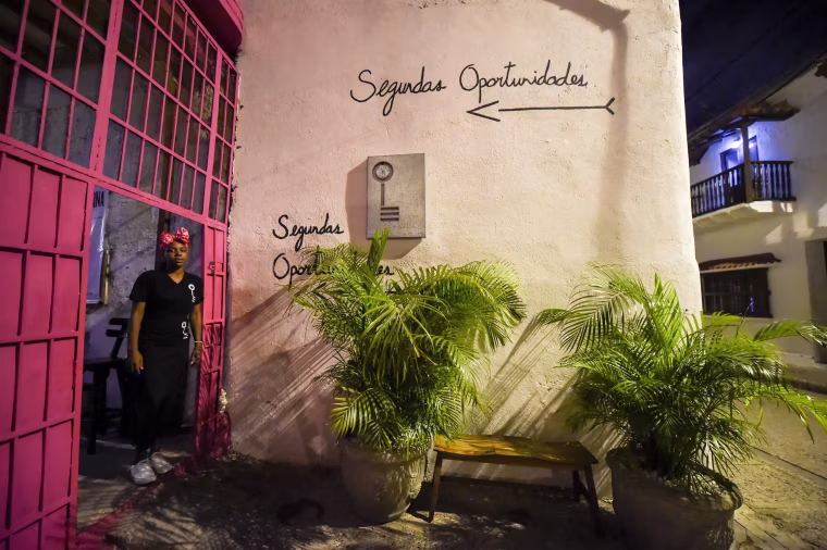 Image: Inmate Arleth Martinez stands in the doorway of the Interno restaurant