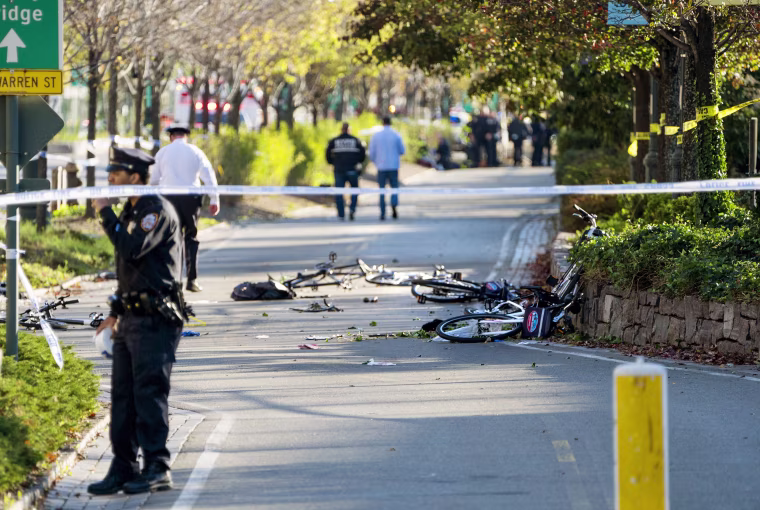 Image: Bicycles and debris lay on a bike path
