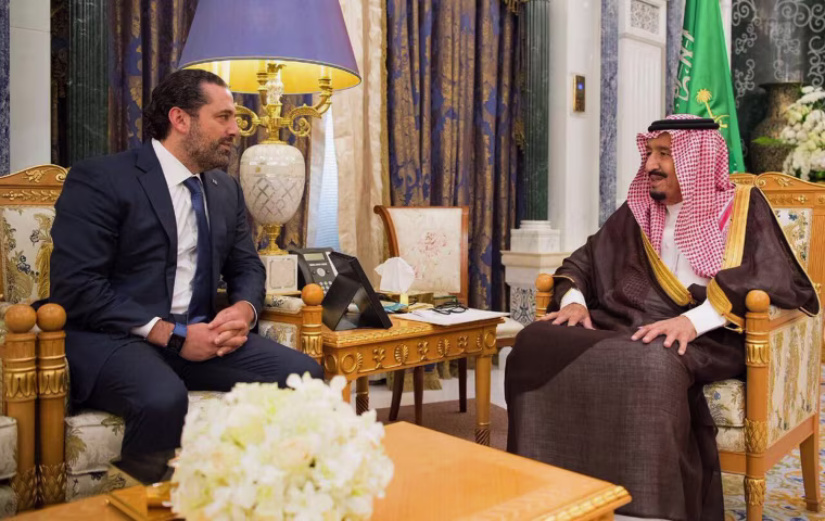 Image: Saudi King Salman, right, meets with outgoing Lebanese Prime Minister Saad Hariri in Riyadh