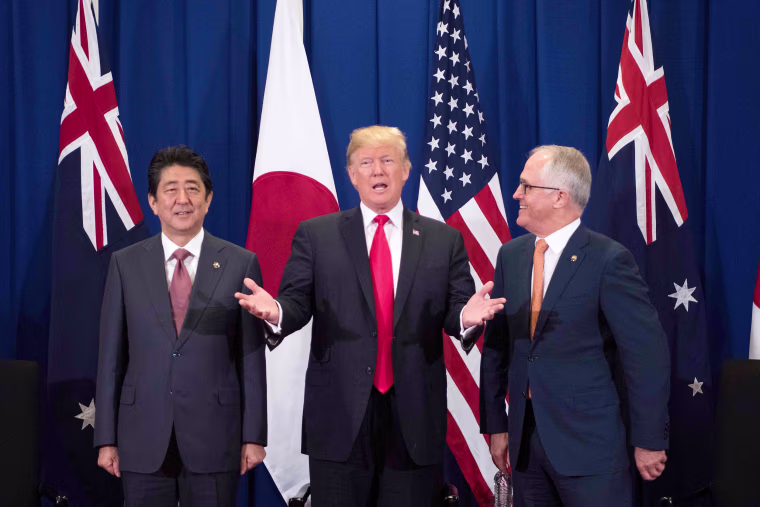 Image: Japan's Prime Minister Shinzo Abe, Trump and Australian Prime Minister Malcolm Turnbull attend a trilateral meeting during the opening ceremony of the ASEAN Summit on Nov. 13.