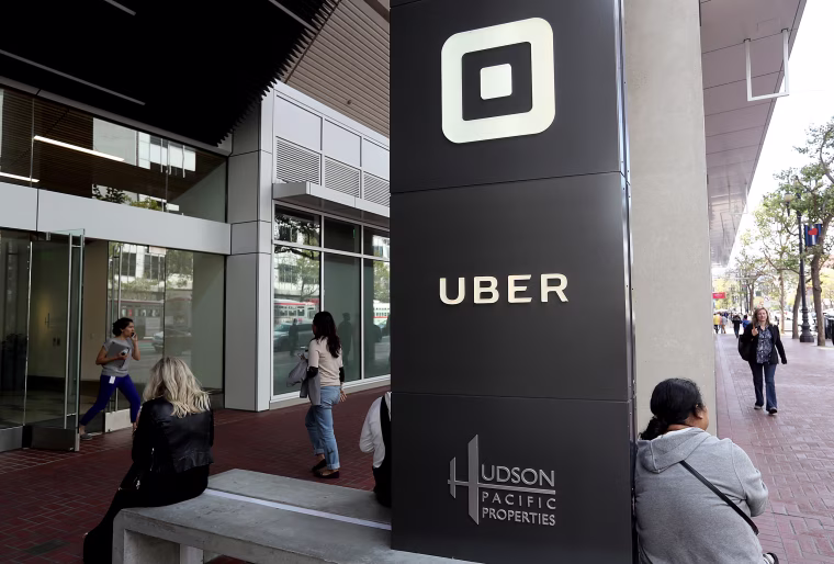 Image: The logo of the ride sharing service Uber is seen in front of its headquarters