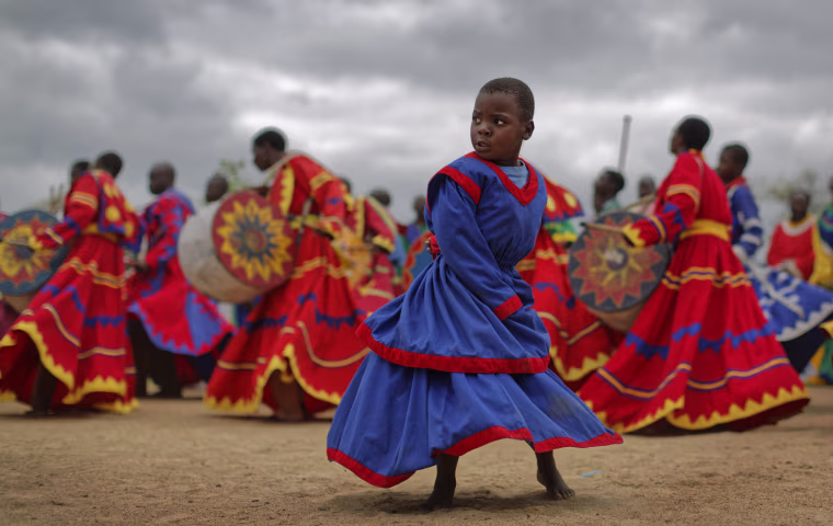 Image: Members of the International Apostolic Ejuwel Jekenisheni Church dance, sing, pray, and play drums during a morning service at the open-air church
