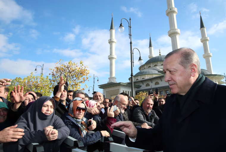 Image: Turkish President Erdogan greets his supporters after the Friday prayers in Ankara