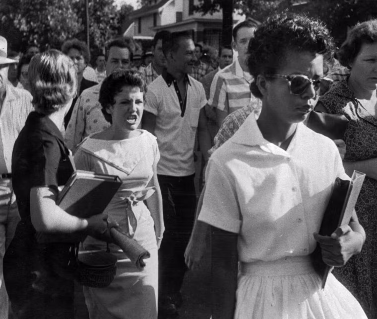 Image: Students of Central High School in Little Rock, Ark. shout insults at Elizabeth Eckford