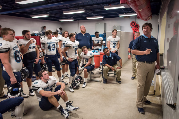 Image: Kingwood's head coach Barry Campbell addresses his team at halftime