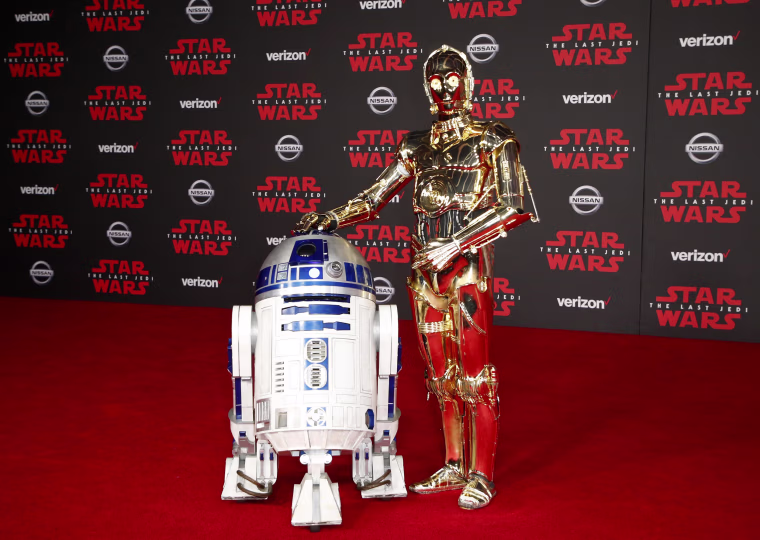 Image: R2-D2, left, and C-3PO walk the red carpet at the World Premiere of "Star Wars: The Last Jedi"