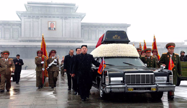Image: Kim Jong-Un and senior members of the North Korean regime walk beside the body of his father Kim Jong-Il in 2011.