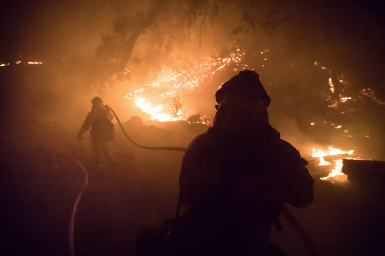 Image: Firefighters battle the blaze on Dec. 15, 2017, in Fillmore, California.