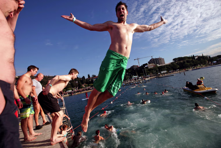 Image: Revellers take part in New Year's Jump into the Sea in Portoroz