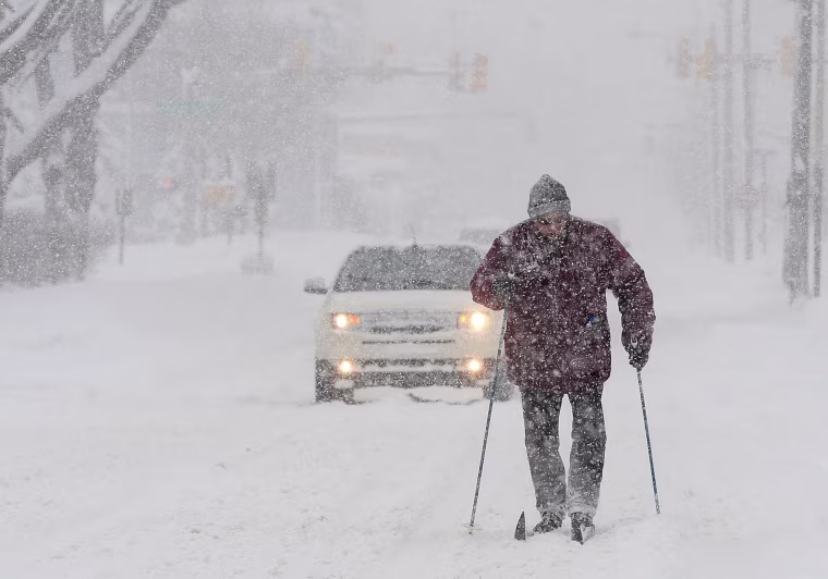 Image: Timothy Gigone, 51, of Erie, Pennsylvania, skis south on Sassafras Street