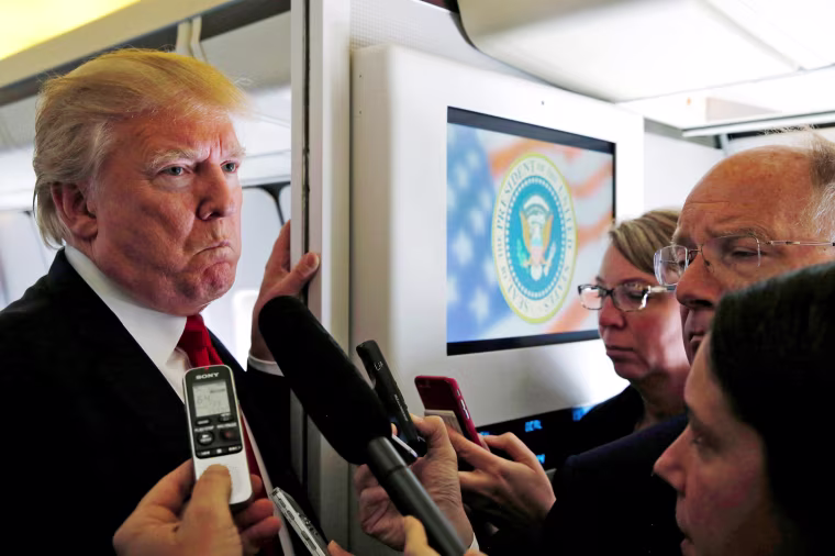 Image: Trump talks to reporters en route to Hanoi, Vietnam