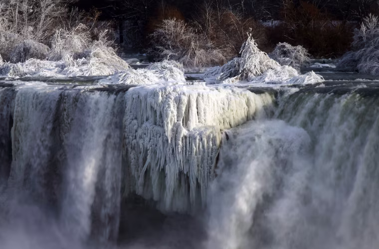 Image: Water flows over the American Falls as viewed from the Canadian side