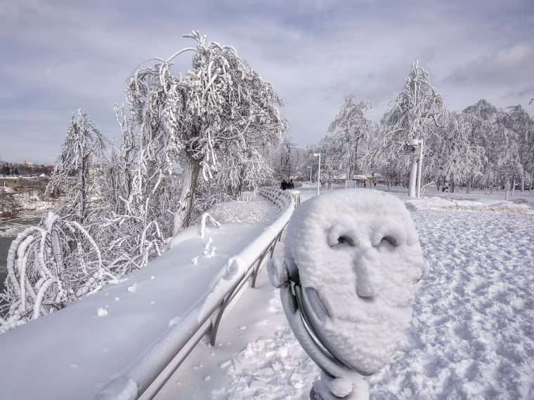 Image: A coin operated binocular is covered with snow on Goat Island at Niagara Falls State Park