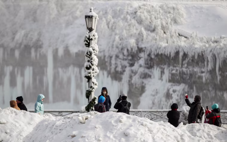 Image: Tourists take photos of the Horseshoe Falls in Niagara Falls