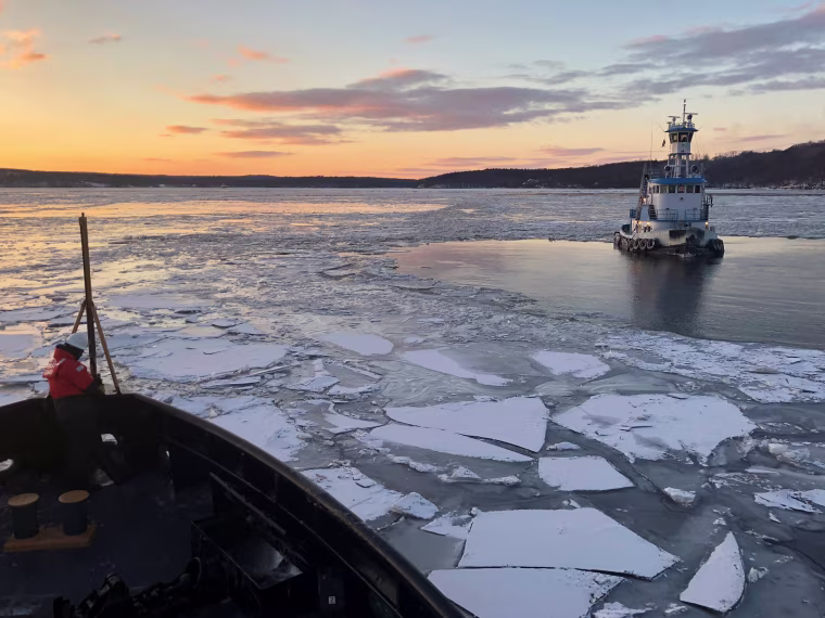 Image: U.S. Coast Guard Cutter Penobscot Bay helps break free tug Stephanie Dann from the ice on the Hudson River near Kingston