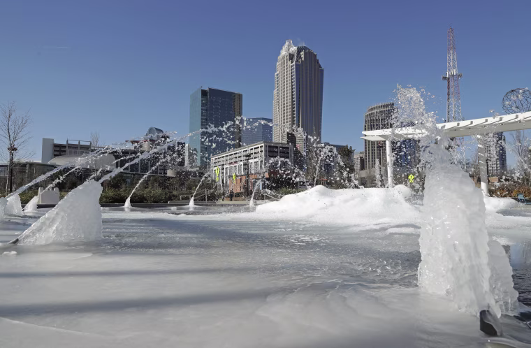 Image: Water squirts from a frozen fountain near downtown in Charlotte