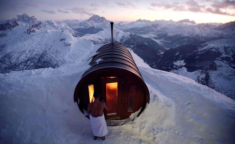 Image: A man enters a sauna on the peak of Mount Lagazuoi