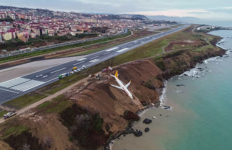 Image: A plane dangles precariously off a muddy cliff in northern Turkey