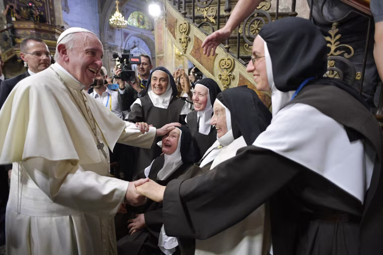 Image: Pope Francis is cheered by nuns as he arrives at Santiago's cathedral in Chile