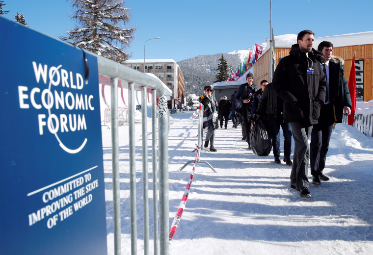 Image: Attendees arrive for the World Economic Forum (WEF) annual meeting in Davos