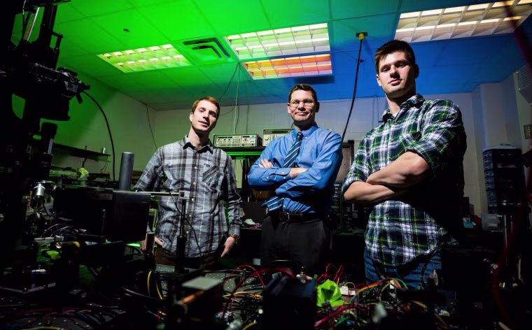 Dr. Daniel Smalley, center, with his student researchers.
