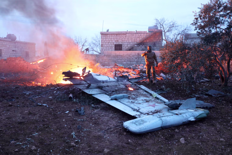 Image: Smoke billows from the site of a downed Sukhoi-25 fighter jet in Syria's northwest province of Idlib on Feb. 3, 2017.