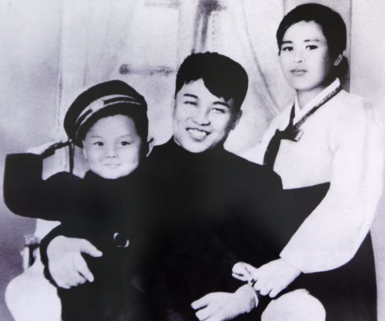 A picture of North Korean founder Kim Il-sung, his first wife Kim Jong-suk and his son Kim Jong-il, is displayed at the Unification Hall at the West Seoul Life Science High School in Seoul on July 17, 2009. North Korean leader Kim Jong-il died on December 17, 2011 state television reported on December 19, 2011. An announcer said he died of physical and mental over-work.