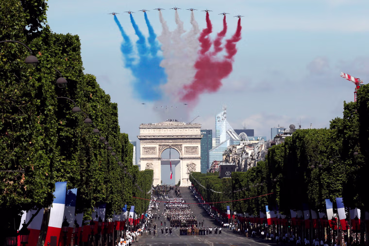 Alpha jets from the French Air Force Patrouille de France fly over the Champs-Elysees avenue during the traditional Bastille Day military parade in Paris, France, July 14, 2017. REUTERS/Gonzalo Fuentes TPX IMAGES OF THE DAY