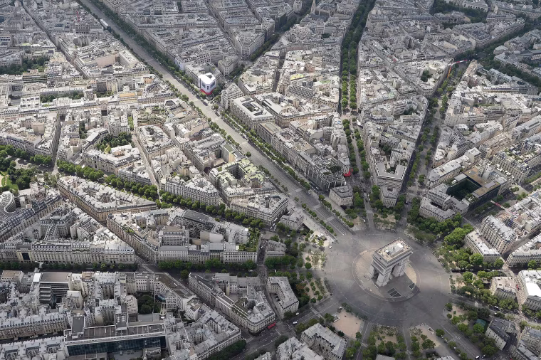 An aerial view shows the Arc de Triomphe before the annual Bastille Day military parade on the Champs-Elysees avenue in Paris on July 14, 2017. The parade on Paris's Champs-Elysees will commemorate the centenary of the US entering WWI and will feature horses, helicopters, planes and troops. / AFP PHOTO / JEAN-SEBASTIEN EVRARDJEAN-SEBASTIEN EVRARD/AFP/Getty Images