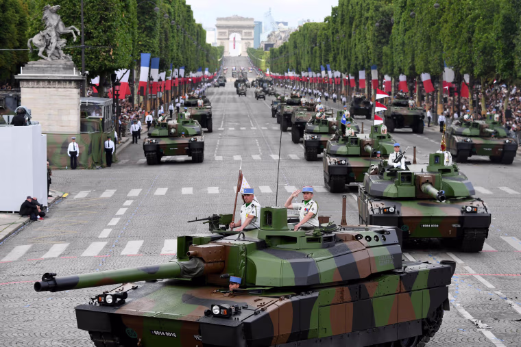 Members of the 5e Regiment de Dragons (5th Dragoon Regiment) parade on Leclerc tanks during the annual Bastille Day military parade on the Champs-Elysees avenue in Paris on July 14, 2017. The parade on Paris's Champs-Elysees will commemorate the centenary of the US entering WWI and will feature horses, helicopters, planes and troops. / AFP PHOTO / ALAIN JOCARDALAIN JOCARD/AFP/Getty Images