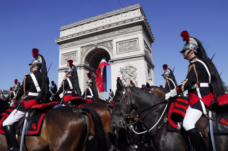 epaselect epa06086309 French Republican guards march during the Bastille Day military parade on the Champs Elysees avenue in Paris, France, 14 July 2017. Bastille Day, the French National Day, is held annually on 14 July to commemorate the storming of the Bastille fortress in 1789. EPA/ETIENNE LAURENT/POOL / POOL MAXPPP OUT