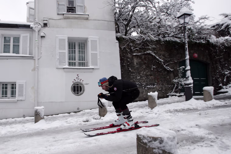A man skis down a street in Montmartre on Feb.7.