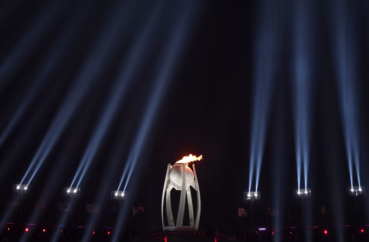 The Olympic Flame burns.