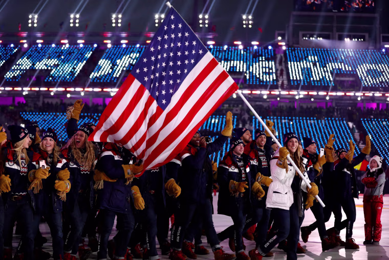 U.S. flagbearer Erin Hamlin leads the delegation during the Parade of Athletes.