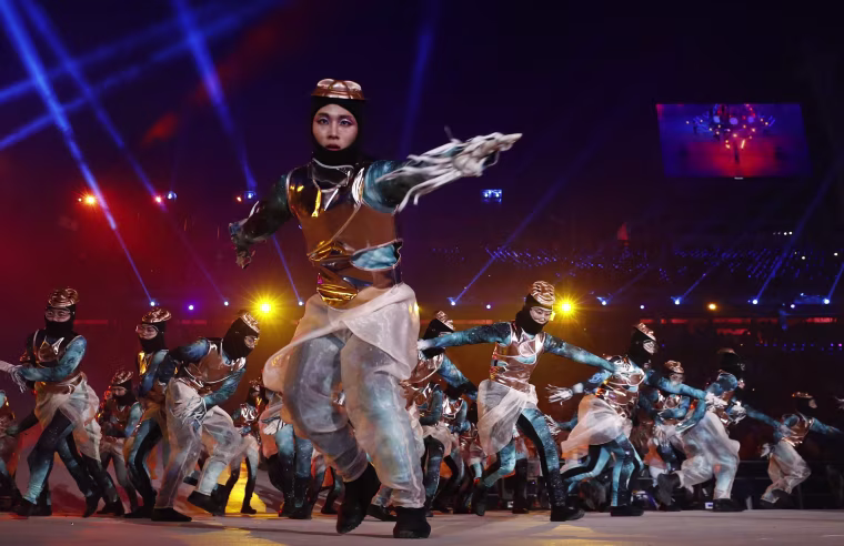 Dancers perform.