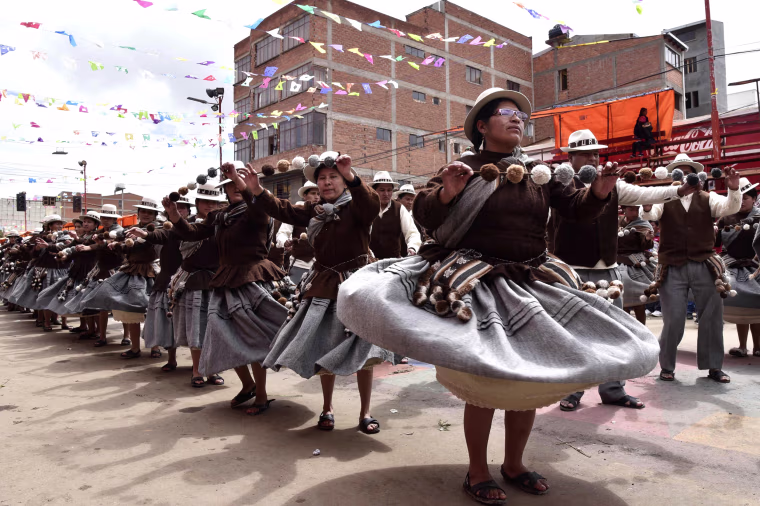 Aymara indigenous people perform traditional Andes highlands folk dances during the Anata Andino harvest festival, ahead of the Oruro Carnival, in Oruro, Bolivia, on Feb. 8, 2018. During the harvest festival, native peasant farmers from different Bolivian highlands communities dance in the streets of Oruro giving thanks to Pachamama (mother earth) for the abundant crops.