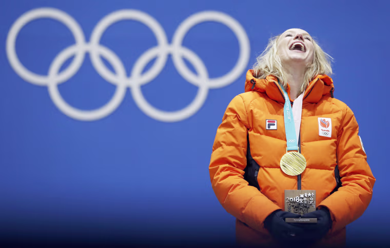 Gold medalist Carlijn Achtereekte of the Netherlands smiles during the medal ceremony for the women's speed skating 3,000 meter event on Feb. 11.