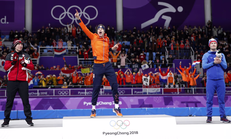 Gold medalist and new Olympic record holder Sven Kramer of The Netherlands celebrates with silver medalist Ted-Jan Bloemen of Canada, left, and bronze medalist Norway's Sverre Lunde Pedersen, right, after the men's 5,000 meter race at the Gangneung Oval on Feb. 11.