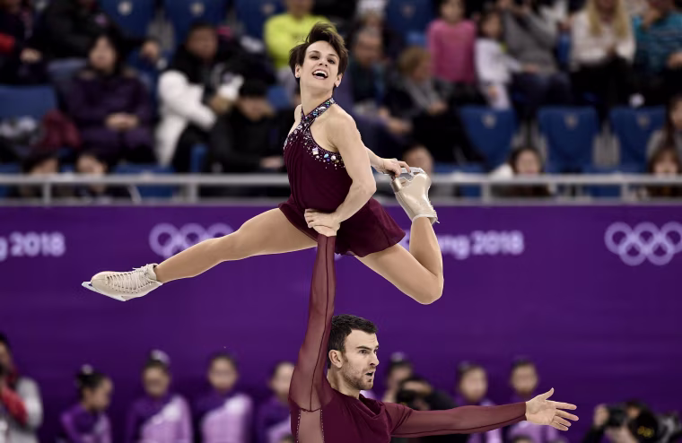 Canada's Meagan Duhamel and Eric Radford compete in the figure skating team event pair skating free skating on Feb. 11.