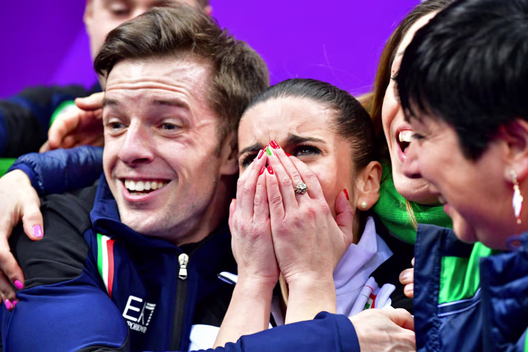 Italy's Valentina Marchei and Ondrej Hotarek react after competing in the figure skating team event pair skating free skating on Feb. 11.