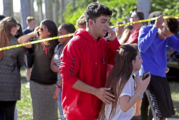 Image: Students released from a lockdown are overcome with emotion
